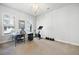 Bright office space with carpet, natural light, and workout equipment for a productive work environment at 217 Napa Dr, Woodstock, GA 30188