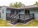 A back deck features modern gray wood and a convenient staircase that leads to the backyard at 2274 Edgemore Se Dr, Atlanta, GA 30316