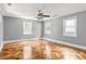 Spacious bedroom featuring three windows, hardwood floors, and neutral-colored walls at 2274 Edgemore Se Dr, Atlanta, GA 30316