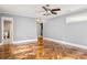 A spacious bedroom features a ceiling fan, wood floors, closet and access to an ensuite bathroom at 2274 Edgemore Se Dr, Atlanta, GA 30316