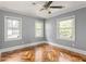 Bedroom featuring three windows, hardwood floors, and neutral-colored walls at 2274 Edgemore Se Dr, Atlanta, GA 30316