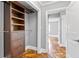 Walk-in closet with built-in shelving, drawers, and rod space for organized storage at 2274 Edgemore Se Dr, Atlanta, GA 30316