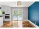 Dining room with a blue accent wall and a sliding glass door leading to the deck at 2274 Edgemore Se Dr, Atlanta, GA 30316