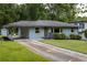 Inviting home with covered parking, fresh landscaping, and a well-manicured lawn at 2274 Edgemore Se Dr, Atlanta, GA 30316