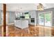 Modern kitchen with stainless steel appliances, a central island, and access to the outdoor deck at 2274 Edgemore Se Dr, Atlanta, GA 30316
