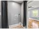 Laundry room with gray walls, wood flooring and a curtain at 2274 Edgemore Se Dr, Atlanta, GA 30316