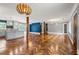 Expansive living space featuring a kitchen island and herringbone wood flooring at 2274 Edgemore Se Dr, Atlanta, GA 30316