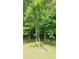 The property has mature trees that provide lots of shade at 2477 Briar Valley Way, Dacula, GA 30019