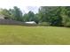 Expansive backyard with soccer net, surrounded by lush greenery and a privacy fence at 2477 Briar Valley Way, Dacula, GA 30019