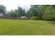 The backyard features an ample green lawn perfect for recreation at 2477 Briar Valley Way, Dacula, GA 30019