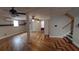 Basement area showcases hardwood floors, support columns, and a window air conditioner at 2477 Briar Valley Way, Dacula, GA 30019