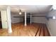 Large finished basement offers hardwood floors, ceiling fans, and access door at 2477 Briar Valley Way, Dacula, GA 30019