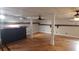 Finished basement features a bar area, hardwood floors, and ceiling fans at 2477 Briar Valley Way, Dacula, GA 30019