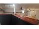 Basement with hardwood floors, wooden bar and trim, ceiling fans, and a window unit at 2477 Briar Valley Way, Dacula, GA 30019