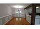 This dining room offers natural light and hardwood floors for an inviting space at 2477 Briar Valley Way, Dacula, GA 30019
