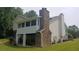 Charming home exterior featuring stone accents and a spacious yard with lush landscaping at 2477 Briar Valley Way, Dacula, GA 30019