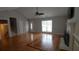 Spacious living room with a fireplace, hardwood floors, and plenty of natural light at 2477 Briar Valley Way, Dacula, GA 30019