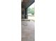 Spacious outdoor patio with unique stone flooring with a large stone fireplace and lush green surroundings at 2477 Briar Valley Way, Dacula, GA 30019