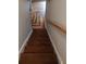 Beautiful staircase with hardwood steps leading up to the main floor with decorative railings at 2477 Briar Valley Way, Dacula, GA 30019