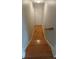 Bright staircase with wooden steps leading to the lower level with hardwood floors at 2477 Briar Valley Way, Dacula, GA 30019