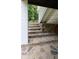 Stone steps underneath a staircase lead to a back door at 2477 Briar Valley Way, Dacula, GA 30019