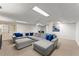 Spacious basement featuring a plush sectional, recessed lighting, and ample room for various activities at 4433 Windsor Oaks Cir, Marietta, GA 30066