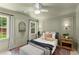 Comfortable bedroom with neutral tones, complemented by abundant natural light from well-placed windows at 4433 Windsor Oaks Cir, Marietta, GA 30066