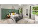 Bright bedroom featuring a modern color scheme, stylish decor, and natural light from multiple windows at 4433 Windsor Oaks Cir, Marietta, GA 30066
