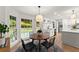 Bright breakfast area with a round table, modern chairs, and a view of the backyard at 4433 Windsor Oaks Cir, Marietta, GA 30066