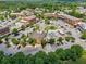 A beautiful aerial view showcases the town square with shops, restaurants, and parking at 6805 Bucks Rd, Cumming, GA 30040