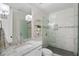 Modern bathroom with marble countertops, a glass-enclosed shower, and stylish fixtures at 6805 Bucks Rd, Cumming, GA 30040
