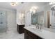 Bright bathroom with marble floors, double vanities, and a glass enclosed shower at 6805 Bucks Rd, Cumming, GA 30040