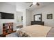 Well-lit bedroom featuring dark wood floors and light neutral walls at 6805 Bucks Rd, Cumming, GA 30040