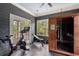 Finished exercise room with personal sauna, work out bench, and exercise bike at 6805 Bucks Rd, Cumming, GA 30040