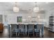 Bright, modern kitchen with a large center island, pendant lighting, and stainless steel appliances at 6805 Bucks Rd, Cumming, GA 30040