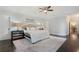 Serene main bedroom featuring a plush bed, neutral decor, and access to other areas of the home at 6805 Bucks Rd, Cumming, GA 30040