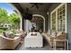Inviting outdoor patio with comfortable seating, a modern fire pit, and outdoor entertainment options at 6805 Bucks Rd, Cumming, GA 30040