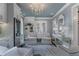 Bright sitting area with custom built-ins, a wine fridge, plush seating and natural light at 6805 Bucks Rd, Cumming, GA 30040