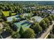 Aerial view of tennis courts and pickleball courts surrounded by lush trees at 6805 Bucks Rd, Cumming, GA 30040