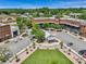 A great aerial view shows a town square featuring shops, offices, a lawn, and parking at 6805 Bucks Rd, Cumming, GA 30040