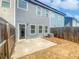 Backyard featuring a concrete patio and wooden fence, offering a private outdoor space at 7119 Gladstone Cir, Lithonia, GA 30038