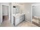 Bathroom featuring double sinks, white countertops, light gray cabinetry, and tile floors at 7119 Gladstone Cir, Lithonia, GA 30038