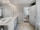 Bathroom featuring double sinks, white countertops, light gray cabinetry, and tile floors at 7119 Gladstone Cir, Lithonia, GA 30038