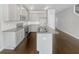 Modern kitchen with granite countertops, gray cabinets, stainless appliances, and hardwood floors at 7119 Gladstone Cir, Lithonia, GA 30038