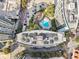 Stunning aerial view of a luxury condo complex with a pool, parking, and city views at 950 W Peachtree Nw St # 1214, Atlanta, GA 30309