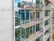 View of stacked balconies on the exterior of the building, offering outdoor living and views from various units at 950 W Peachtree Nw St # 1214, Atlanta, GA 30309