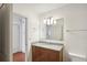 Modern bathroom with granite vanity, dual sinks, and large mirror at 950 W Peachtree Nw St # 1214, Atlanta, GA 30309