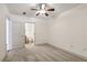 Neutral bedroom with a ceiling fan, carpet, and an attached bathroom with white fixtures at 950 W Peachtree Nw St # 1214, Atlanta, GA 30309
