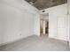 Bedroom with gray carpet, ample lighting, open doors, and closet space at 950 W Peachtree Nw St # 1214, Atlanta, GA 30309