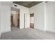 Bedroom with gray carpet and three doors that offer multiple access points to different rooms at 950 W Peachtree Nw St # 1214, Atlanta, GA 30309